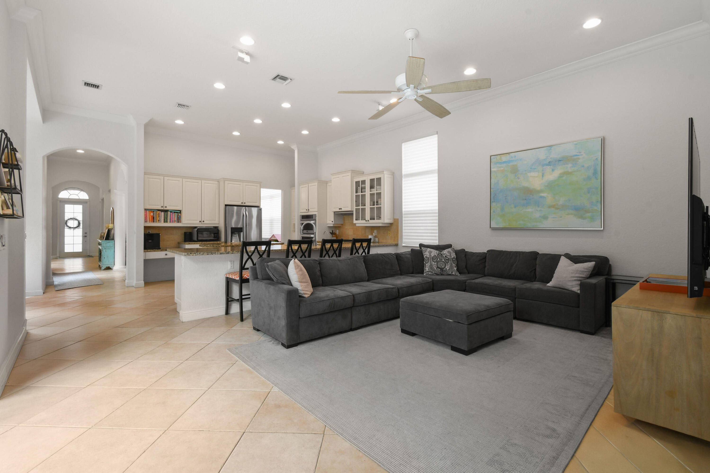 111 Bilboa Drive Jupiter, FL 33458 - Photo 16 of 35 a living room with furniture and kitchen view