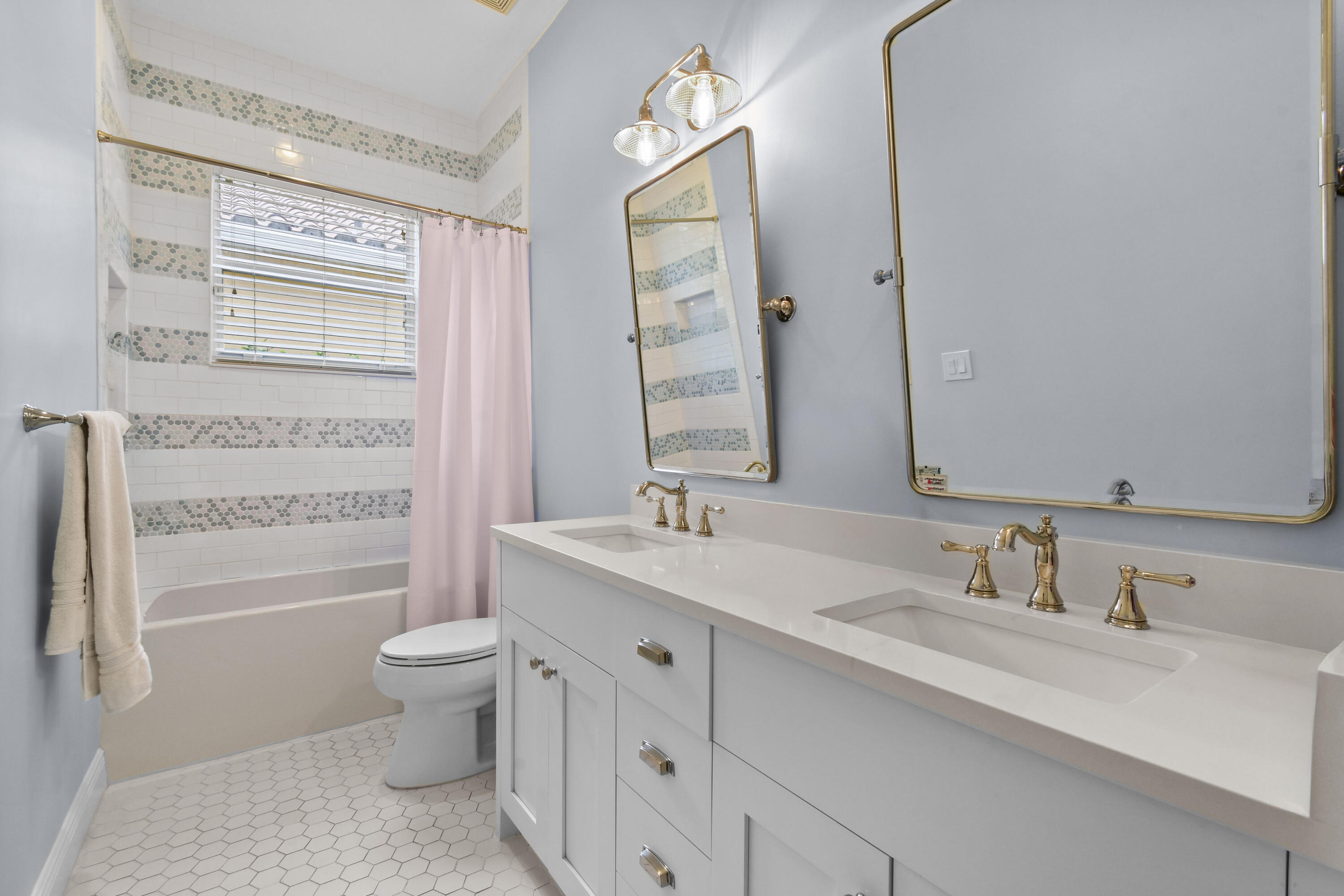 111 Bilboa Drive Jupiter, FL 33458 - Photo 21 of 35 a bathroom with a granite countertop sink and a mirror