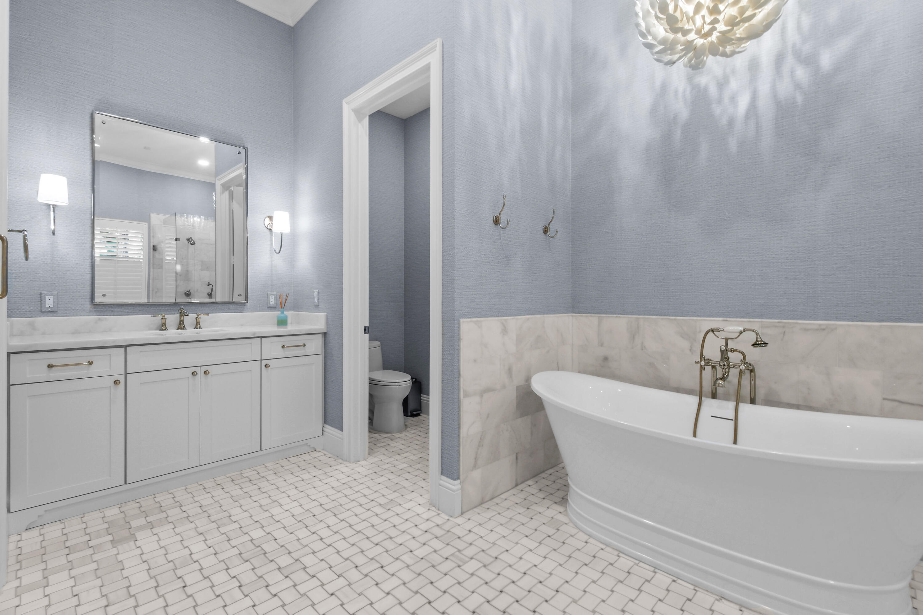 111 Bilboa Drive Jupiter, FL 33458 - Photo 24 of 35 a bathroom with a bathtub and a sink