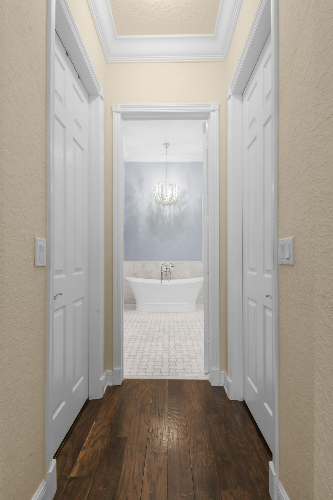 111 Bilboa Drive Jupiter, FL 33458 - Photo 26 of 35 a view of a hallway with wooden floor and a bathroom