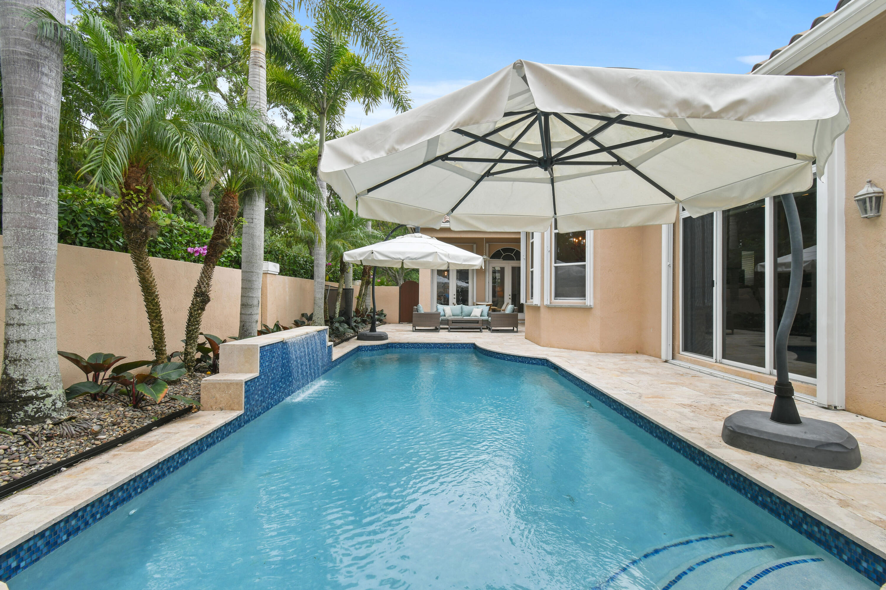 111 Bilboa Drive Jupiter, FL 33458 - Photo 29 of 35 a view of a house with backyard and sitting area