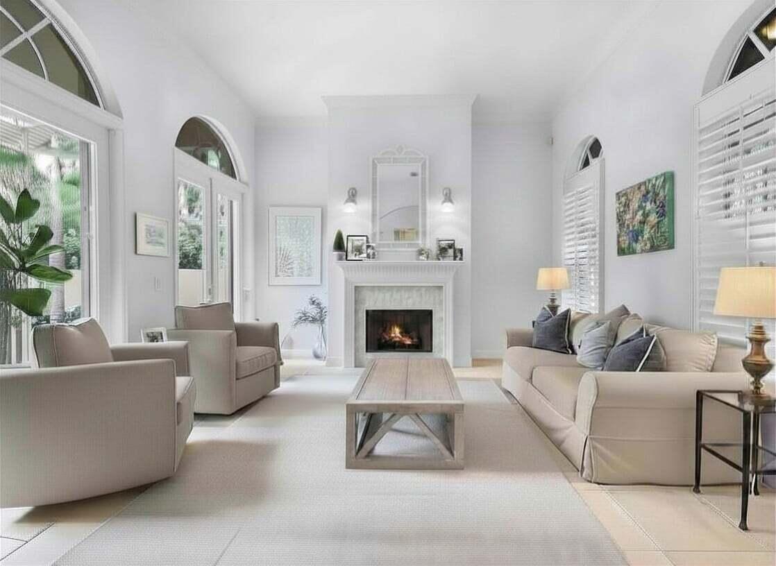 111 Bilboa Drive Jupiter, FL 33458 - Photo 6 of 35 a living room with furniture and a fireplace