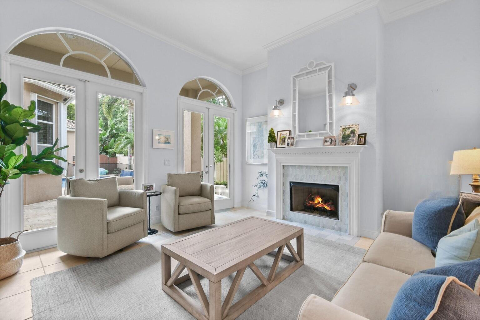 111 Bilboa Drive Jupiter, FL 33458 - Photo 7 of 35 a living room with furniture and a fireplace