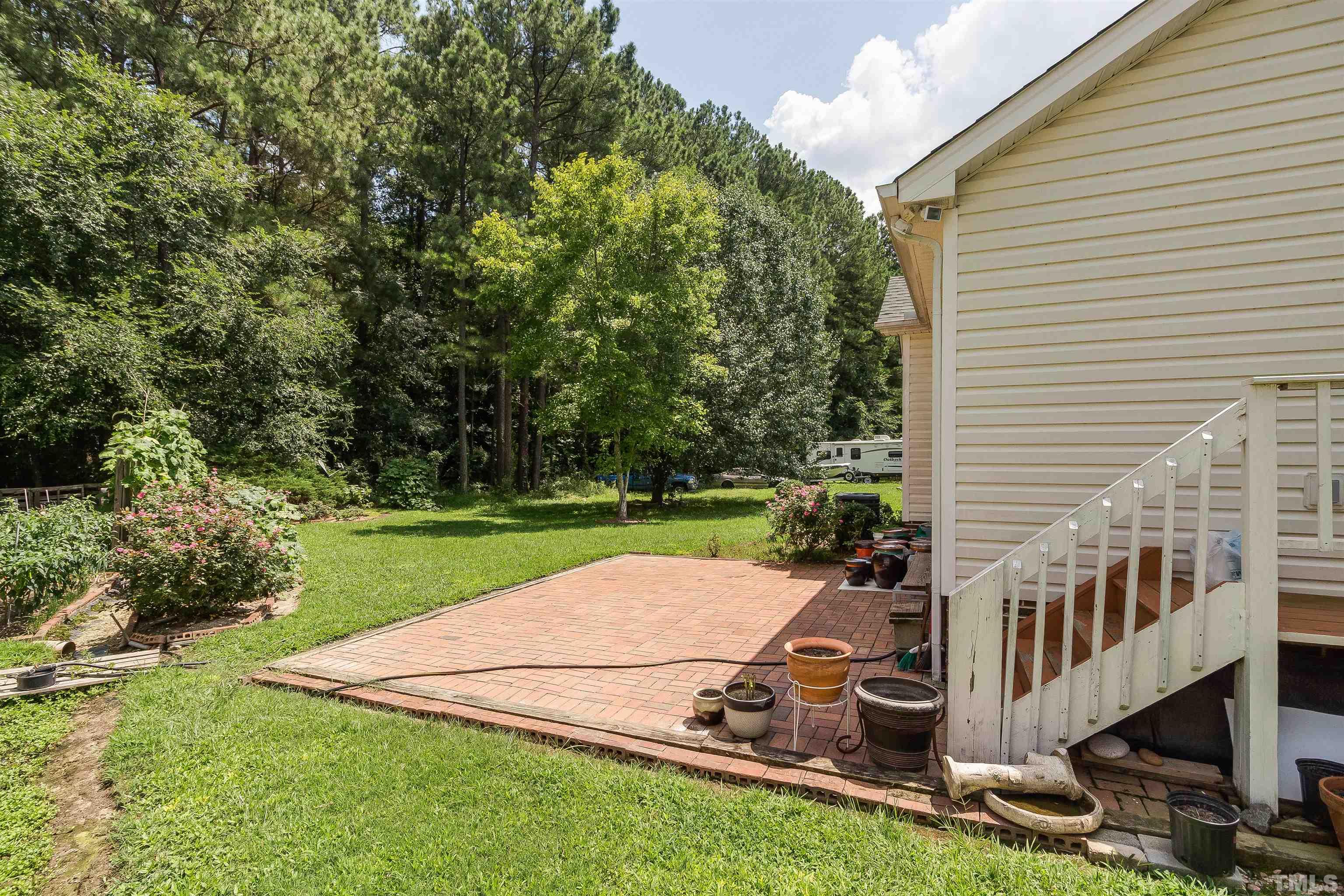 4216 Wolftrap Road Raleigh, NC 27616 - Photo 16 of 20 an aerial view of a house with backyard space and balcony
