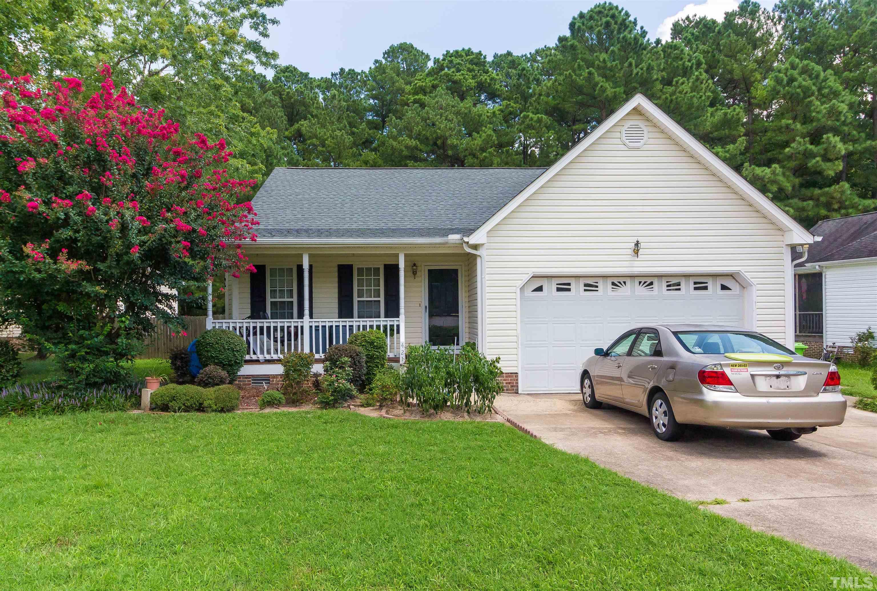 4216 Wolftrap Road Raleigh, NC 27616 - Photo 19 of 20 a car parked in front of white house