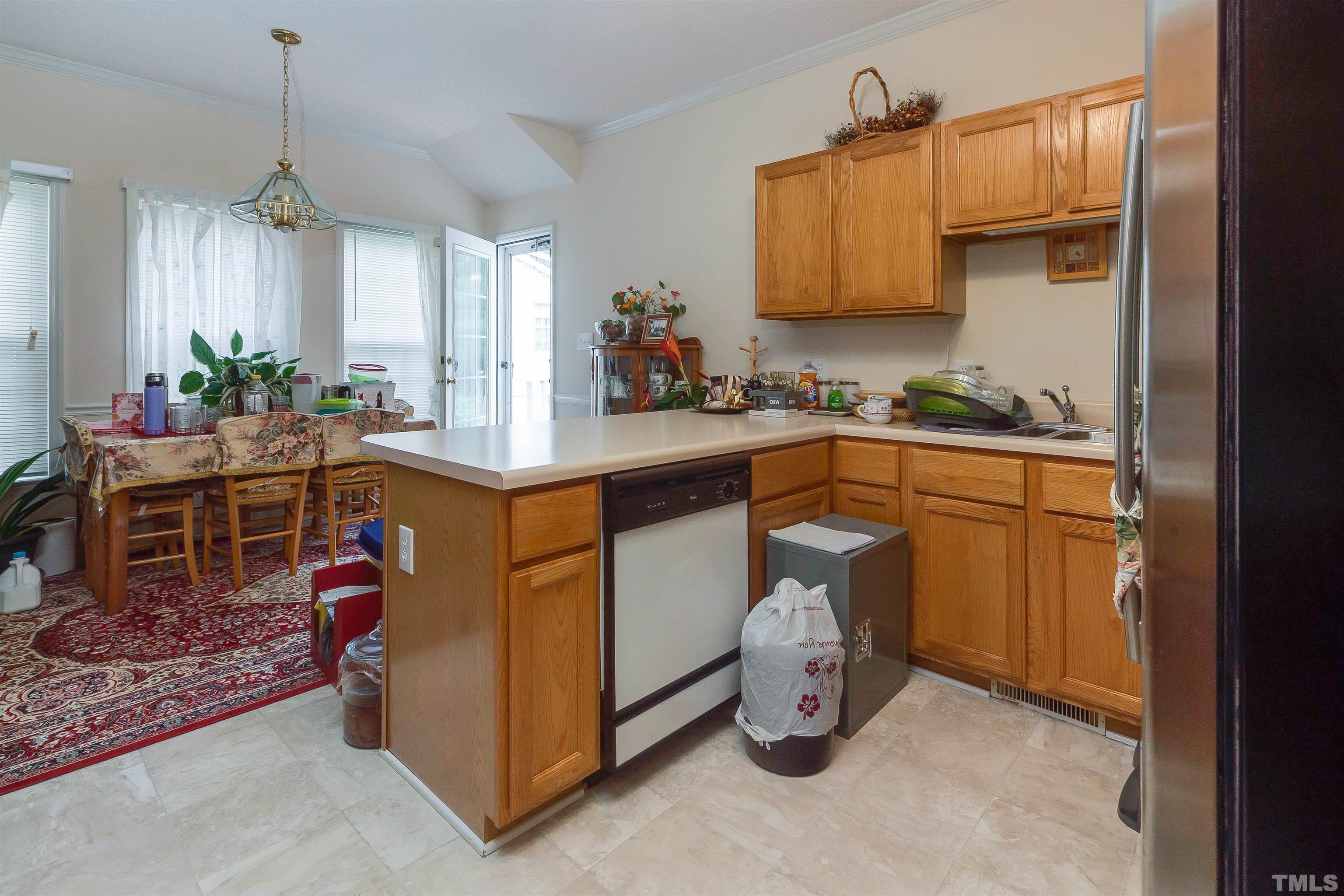 4216 Wolftrap Road Raleigh, NC 27616 - Photo 6 of 20 a kitchen with a sink and cabinets