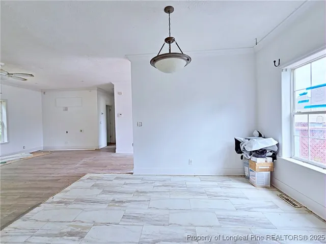 a view of room with window and wooden floor