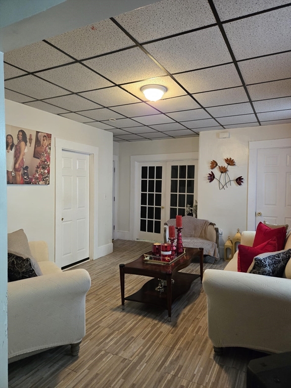 100 Bailey Street, Unit 1 Lawrence, MA 01843 - Photo 2 of 8 a living room with furniture and wooden floor