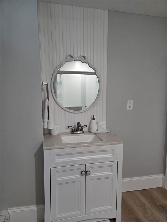 100 Bailey Street, Unit 1 Lawrence, MA 01843 - Photo 7 of 8 a bathroom with a sink and a mirror