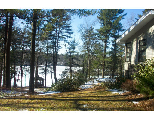 35 Beaver Pond Road Beverly, MA 01915 - Photo 1 of 6 a view of a fountain in front of a house