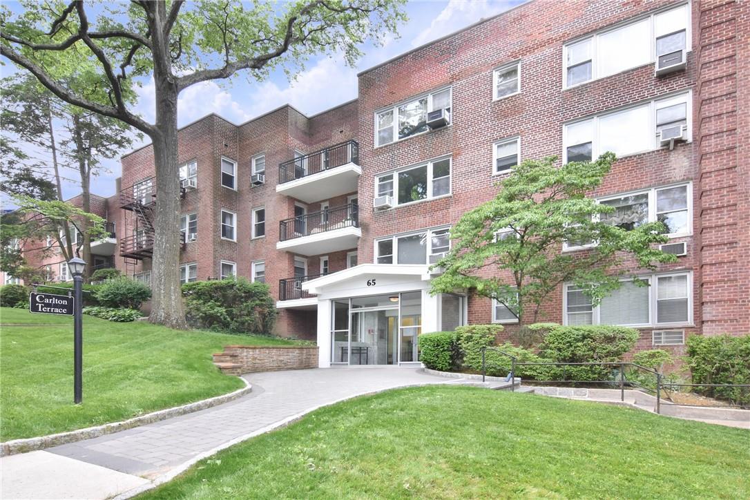 a view of a building with a yard