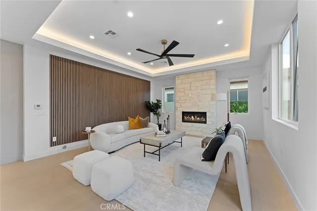 a living room with furniture and a potted plant