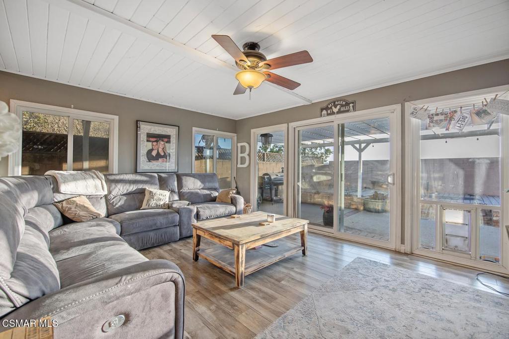 4787 North Buttercreek Road Moorpark, CA 93021 - Photo 13 of 31 a living room with furniture and a floor to ceiling window