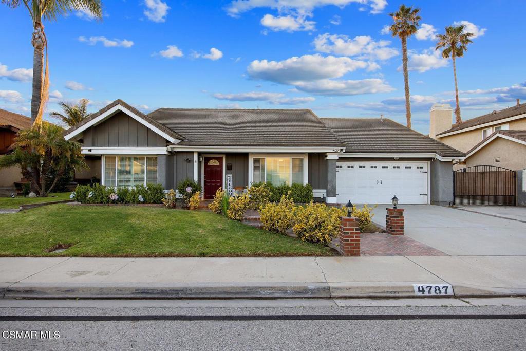 4787 North Buttercreek Road Moorpark, CA 93021 - Photo 3 of 31 a front view of a house with a garden