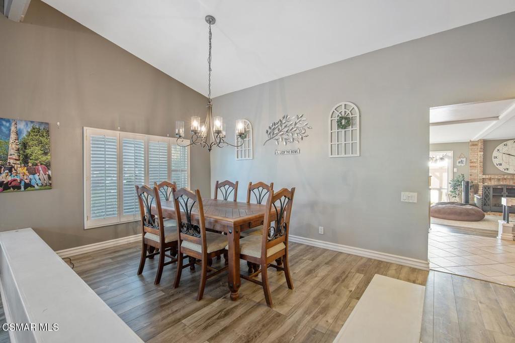 4787 North Buttercreek Road Moorpark, CA 93021 - Photo 9 of 31 a view of a dining room with furniture a chandelier and wooden floor