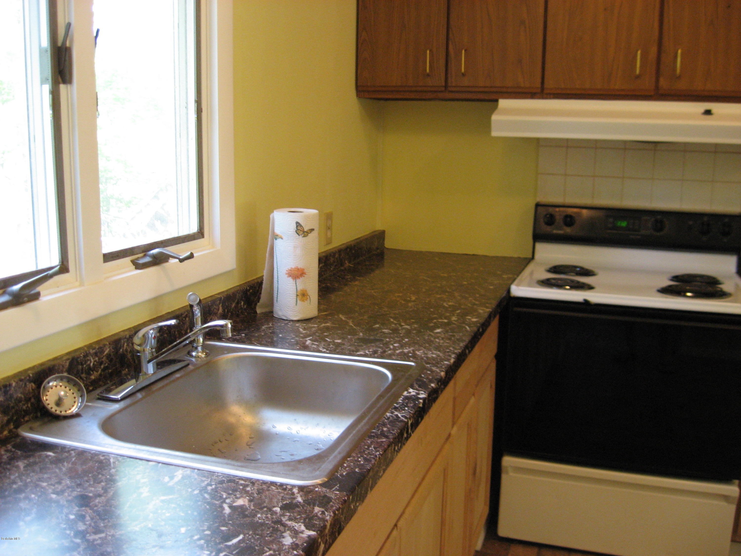 24 Access 3 Road Savoy, MA 01256 - Photo 13 of 19 a kitchen with a sink and a stove top oven