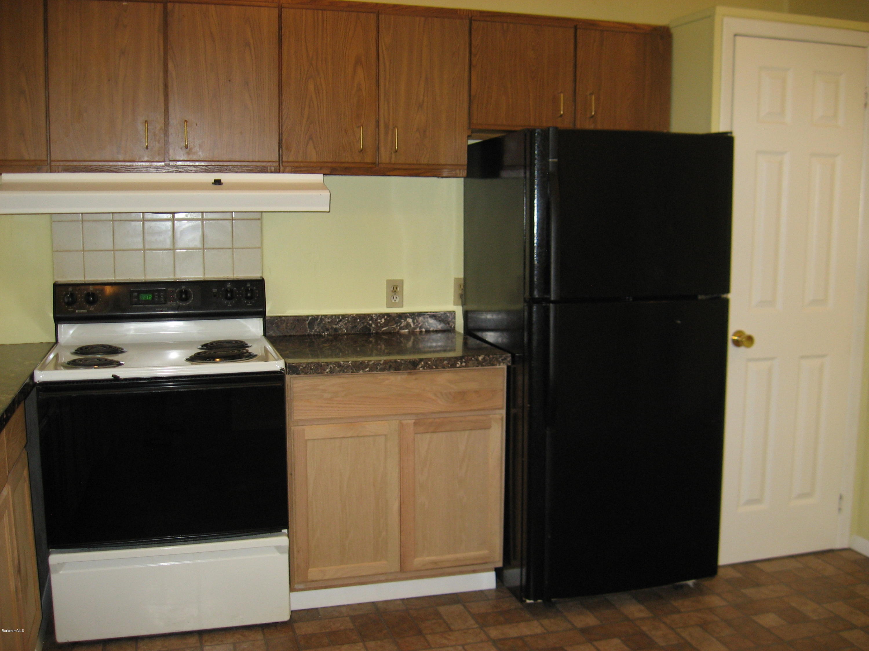 24 Access 3 Road Savoy, MA 01256 - Photo 14 of 19 a kitchen with a refrigerator and a stove
