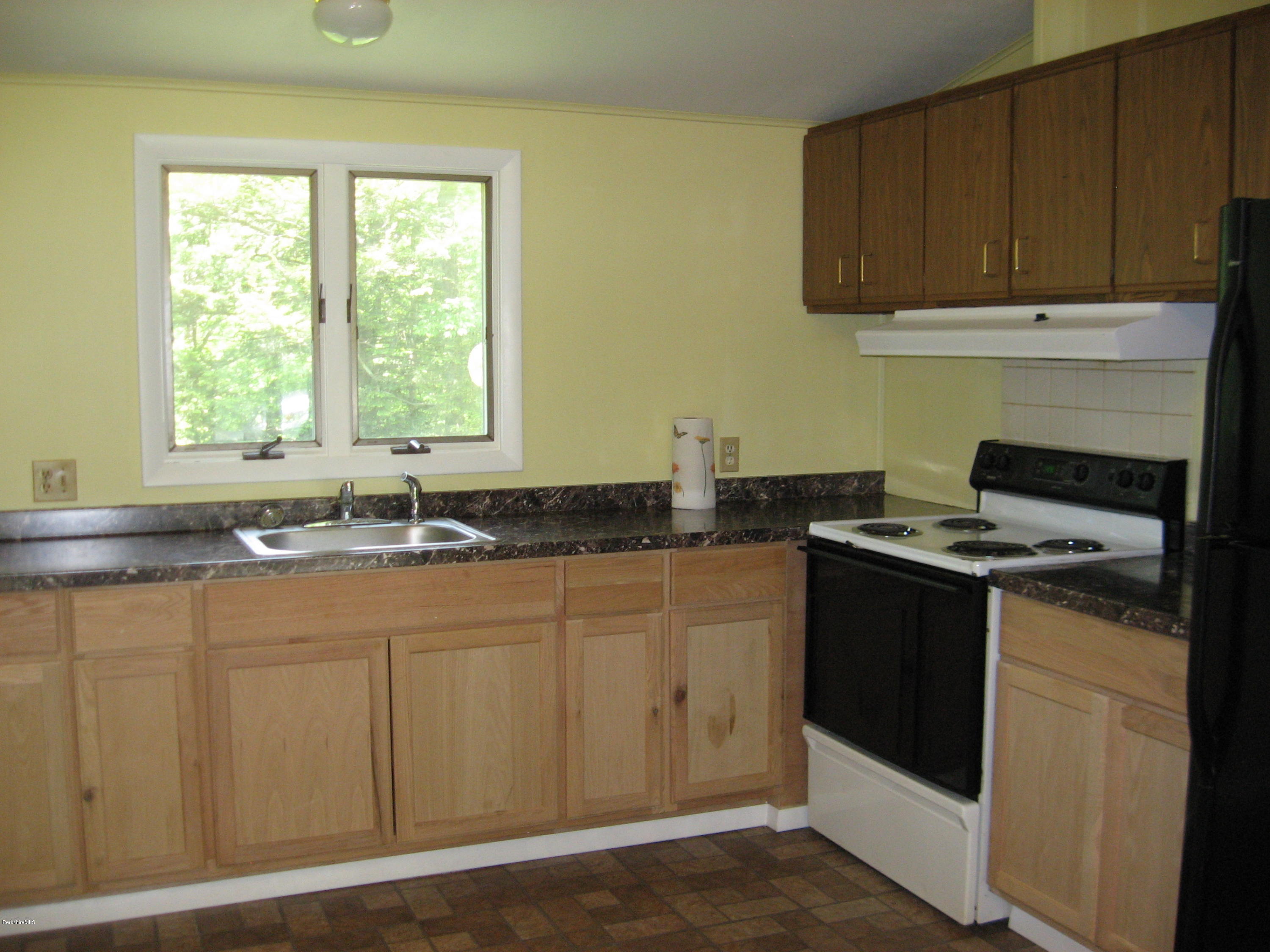 24 Access 3 Road Savoy, MA 01256 - Photo 15 of 19 a kitchen with granite countertop a sink and a stove