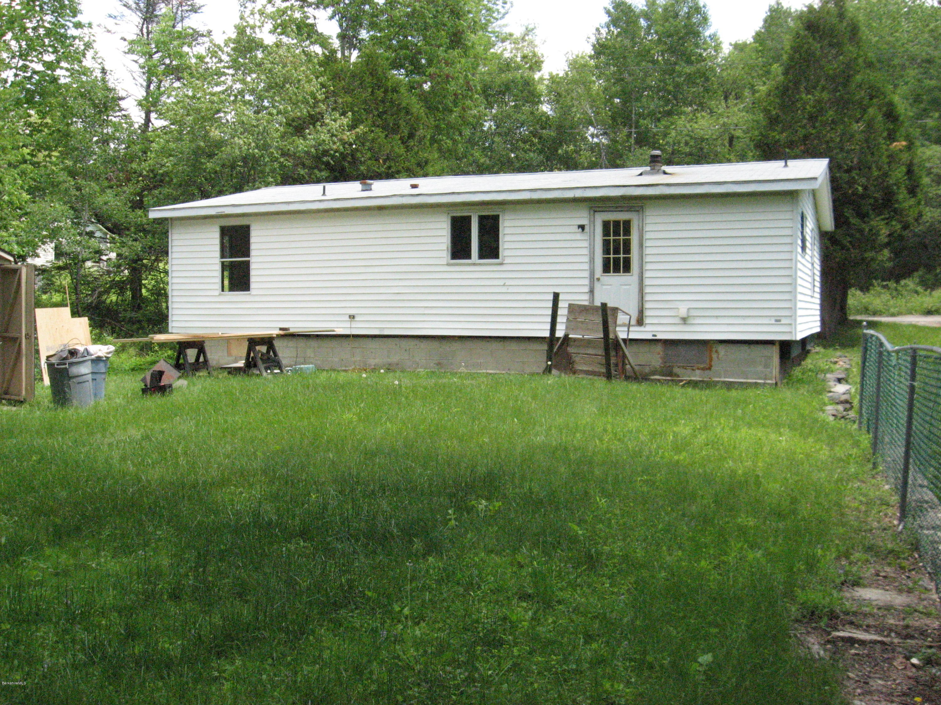 24 Access 3 Road Savoy, MA 01256 - Photo 3 of 19 a backyard of a house with table and chairs