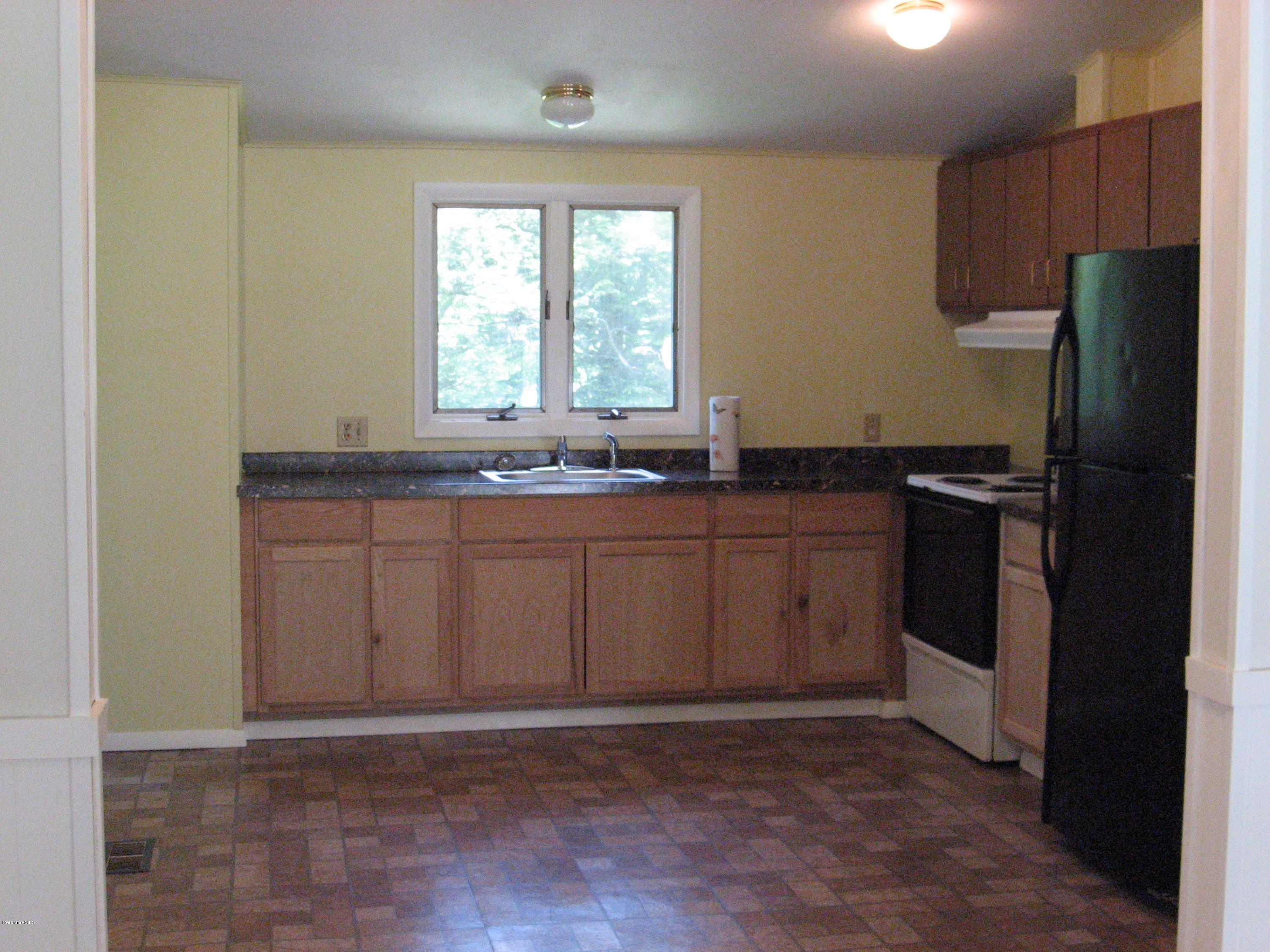 24 Access 3 Road Savoy, MA 01256 - Photo 5 of 19 a kitchen with stainless steel appliances a sink and a refrigerator