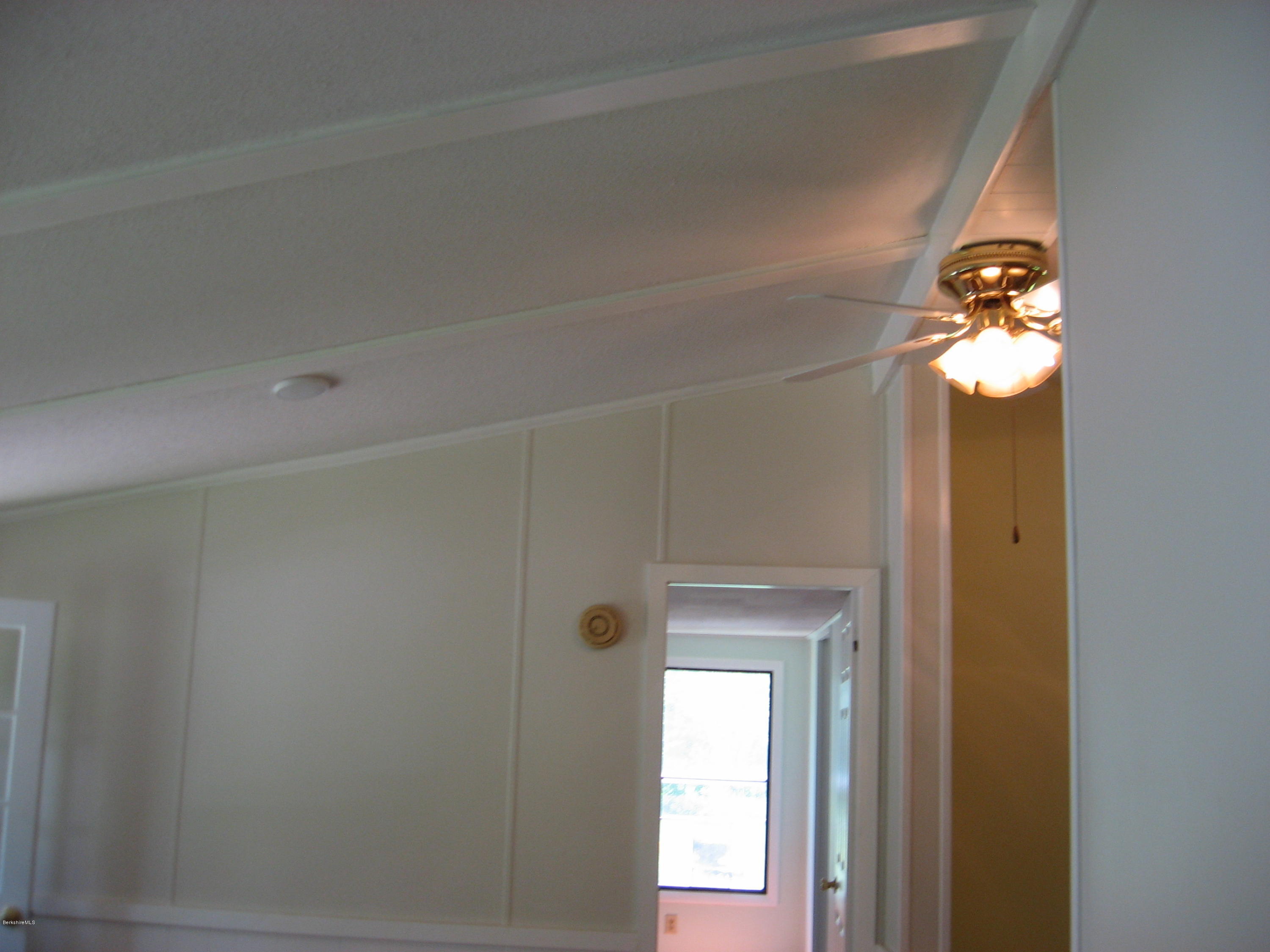 24 Access 3 Road Savoy, MA 01256 - Photo 8 of 19 a view of a chandelier fan and wooden floor