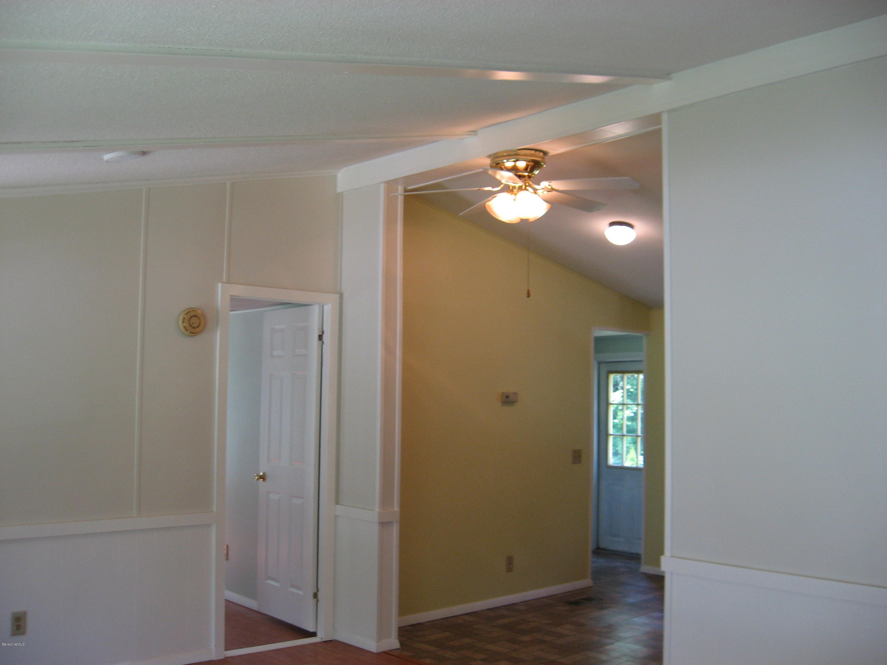 24 Access 3 Road Savoy, MA 01256 - Photo 9 of 19 a view of a livingroom with a fireplace