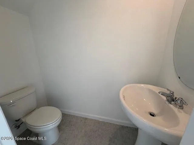 a bathroom with a sink and a toilet