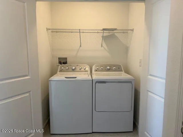 a utility room with dryer and washer