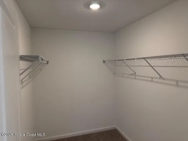 a view of a room with racks on the wall