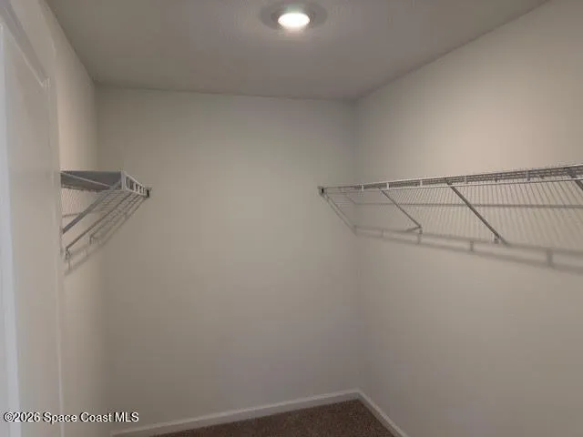 a view of a room with racks on the wall