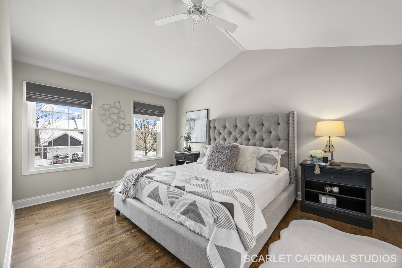 295 Meadowview Lane Aurora, IL 60502 - Photo 16 of 42 a large bedroom with a bed and a chandelier