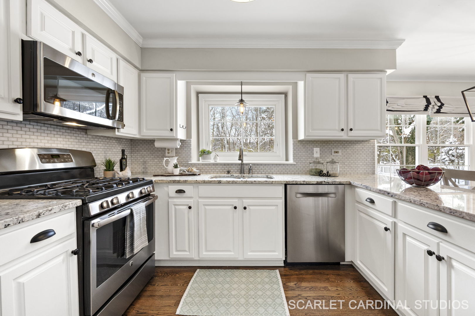 295 Meadowview Lane Aurora, IL 60502 - Photo 9 of 42 a kitchen with stainless steel appliances granite countertop white cabinets a stove top oven a sink and dishwasher