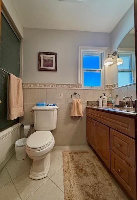 1817 Madison Place Brooklyn, NY 11229 - Photo 12 of 28 a bathroom with a toilet sink and mirror
