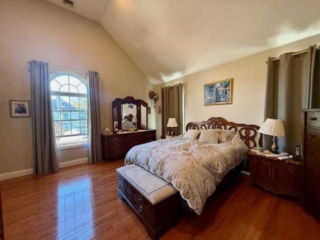 1817 Madison Place Brooklyn, NY 11229 - Photo 15 of 28 a spacious bedroom with a bed and a flat screen tv