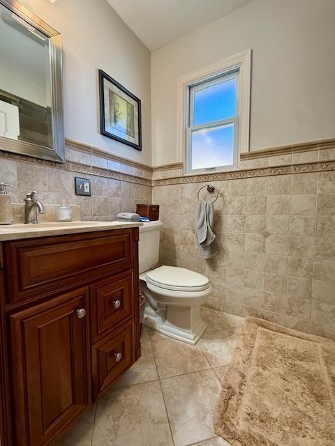 1817 Madison Place Brooklyn, NY 11229 - Photo 16 of 28 a bathroom with a toilet a sink and mirror