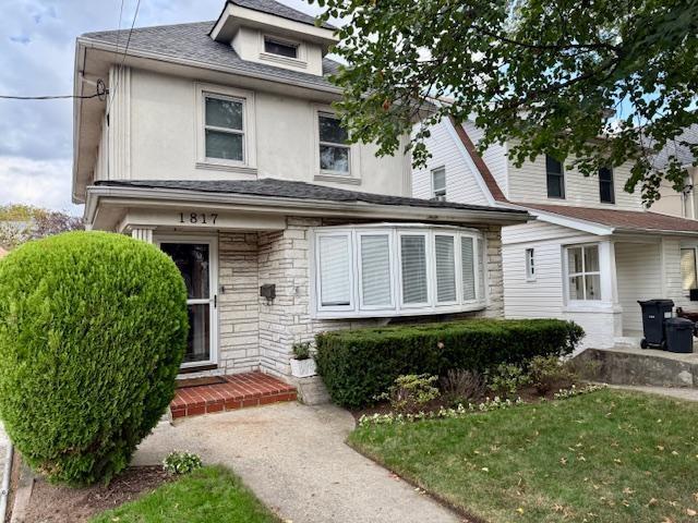 1817 Madison Place Brooklyn, NY 11229 - Photo 2 of 28 a front view of a house with a garden