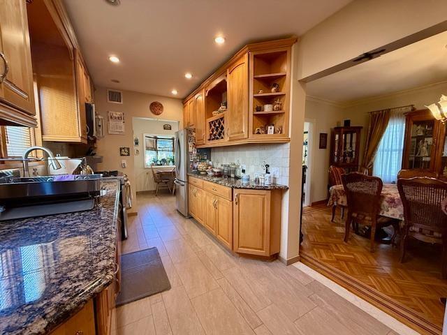 1817 Madison Place Brooklyn, NY 11229 - Photo 21 of 28 a kitchen with stainless steel appliances granite countertop a stove top oven a sink a dining table and chairs with wooden floor