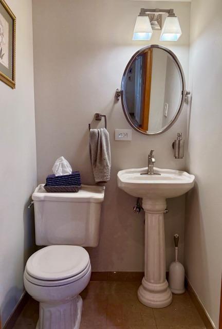 1817 Madison Place Brooklyn, NY 11229 - Photo 23 of 28 a bathroom with a toilet sink and mirror