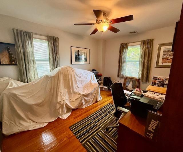 1817 Madison Place Brooklyn, NY 11229 - Photo 9 of 28 a bedroom with a bed and a chandelier