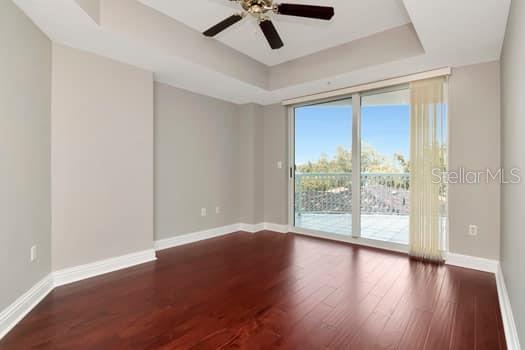 3507 Bayshore Boulevard, Unit 302 Tampa, FL 33629 - Photo 16 of 47 wooden floor in an empty room with a window