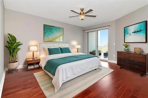 a spacious bedroom with a large bed and a window