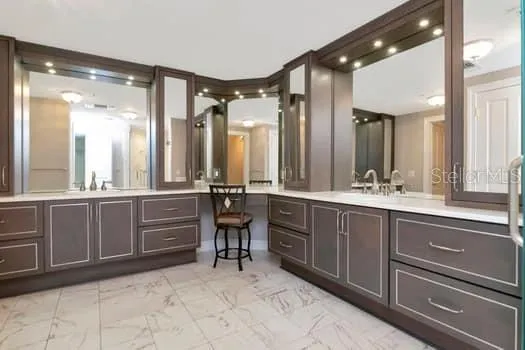 a bathroom with a sink vanity and mirror