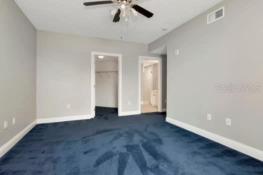 3507 Bayshore Boulevard, Unit 302 Tampa, FL 33629 - Photo 22 of 47 an empty room with ceiling fan and window