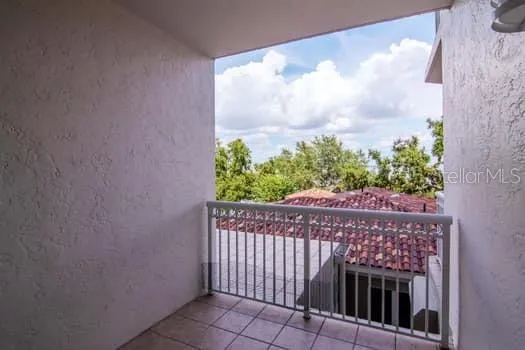 a view of a house with backyard and porch