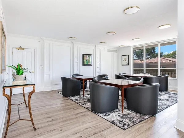 a media room with lots of chairs and a projector screen