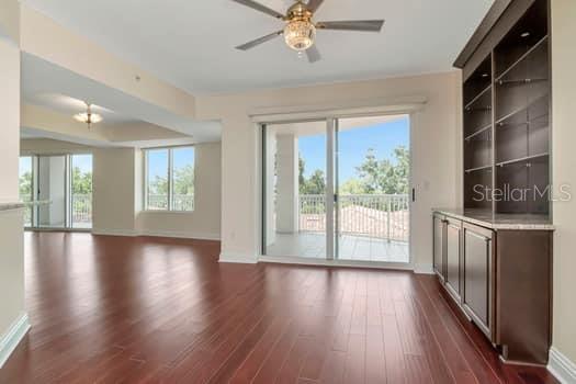 3507 Bayshore Boulevard, Unit 302 Tampa, FL 33629 - Photo 7 of 47 a view of an empty room with wooden floor and a window