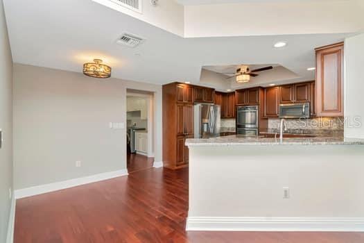 3507 Bayshore Boulevard, Unit 302 Tampa, FL 33629 - Photo 9 of 47 a kitchen with stainless steel appliances granite countertop a sink and a refrigerator