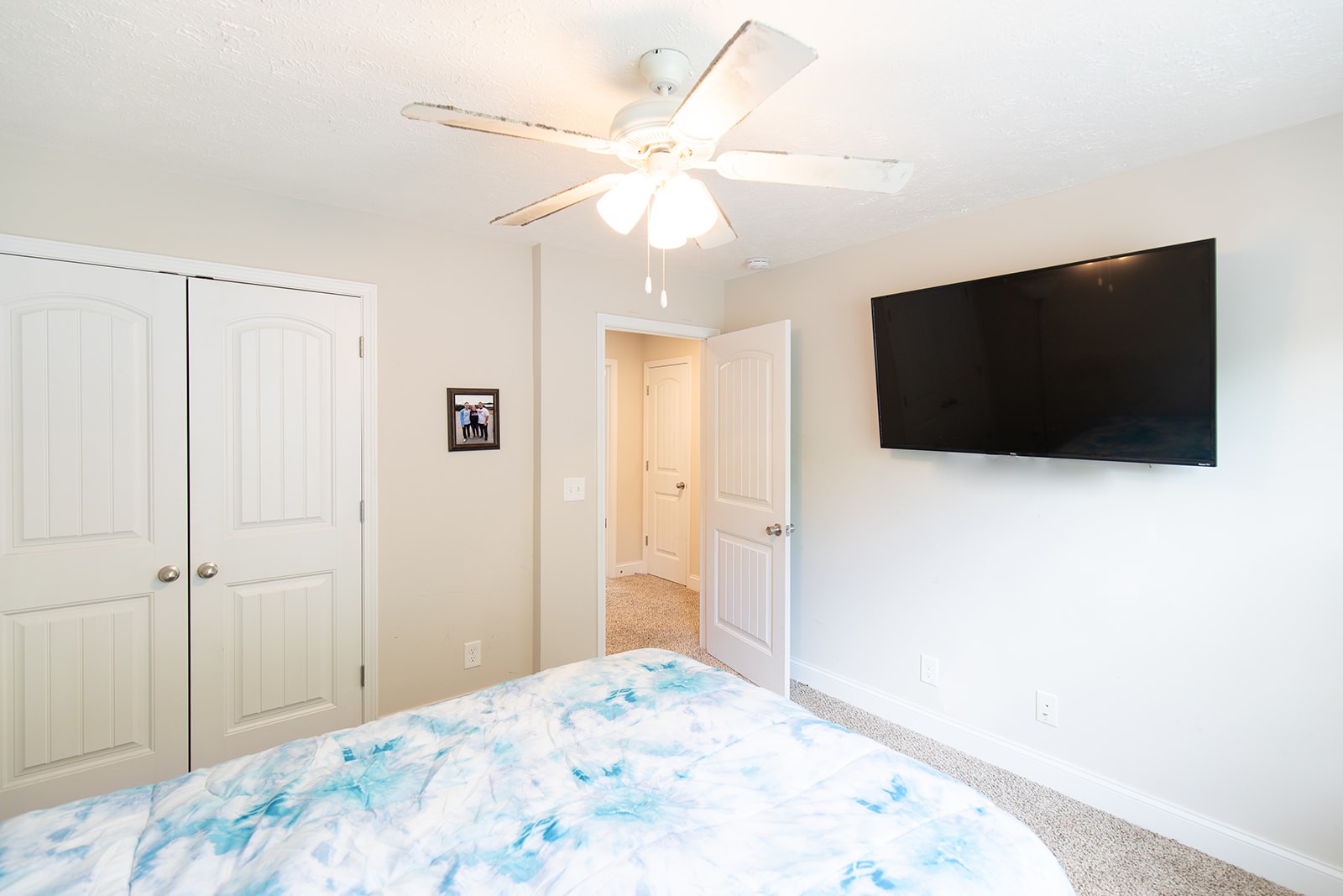 1045 Fuji Lane Clarksville, TN 37040 - Photo 19 of 24 a bedroom with a bed and a flat screen tv