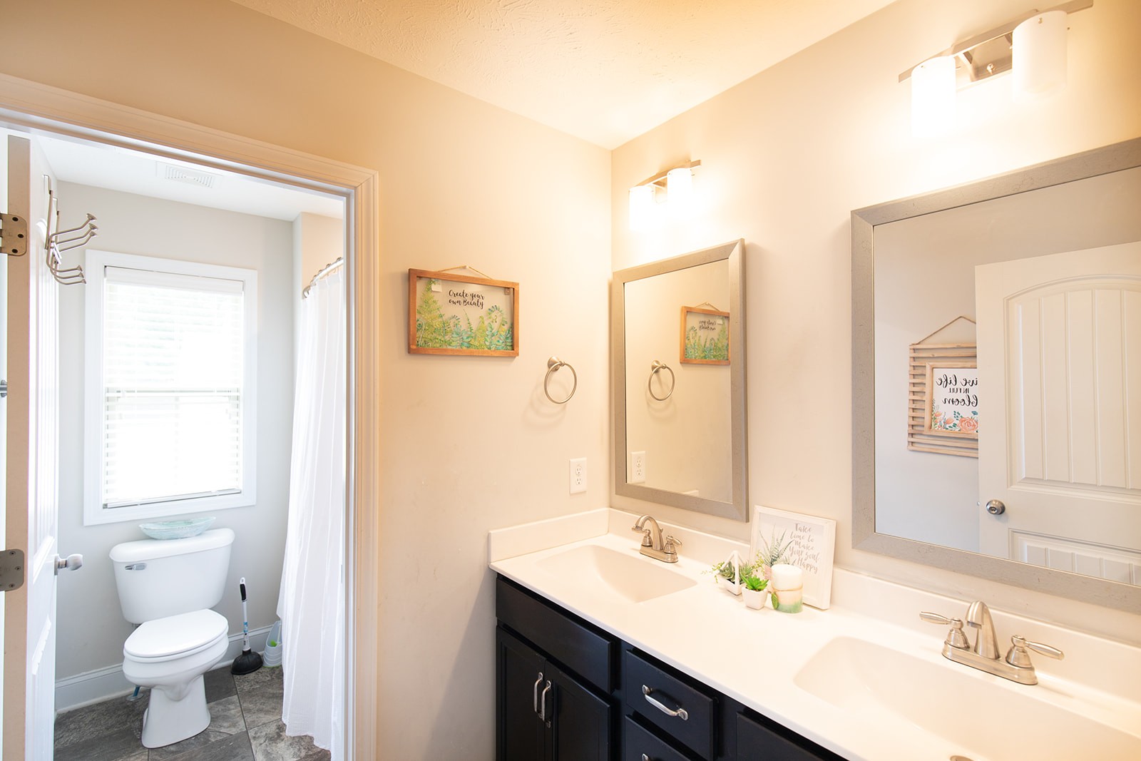 1045 Fuji Lane Clarksville, TN 37040 - Photo 21 of 24 a bathroom with a double vanity sink toilet and a mirror
