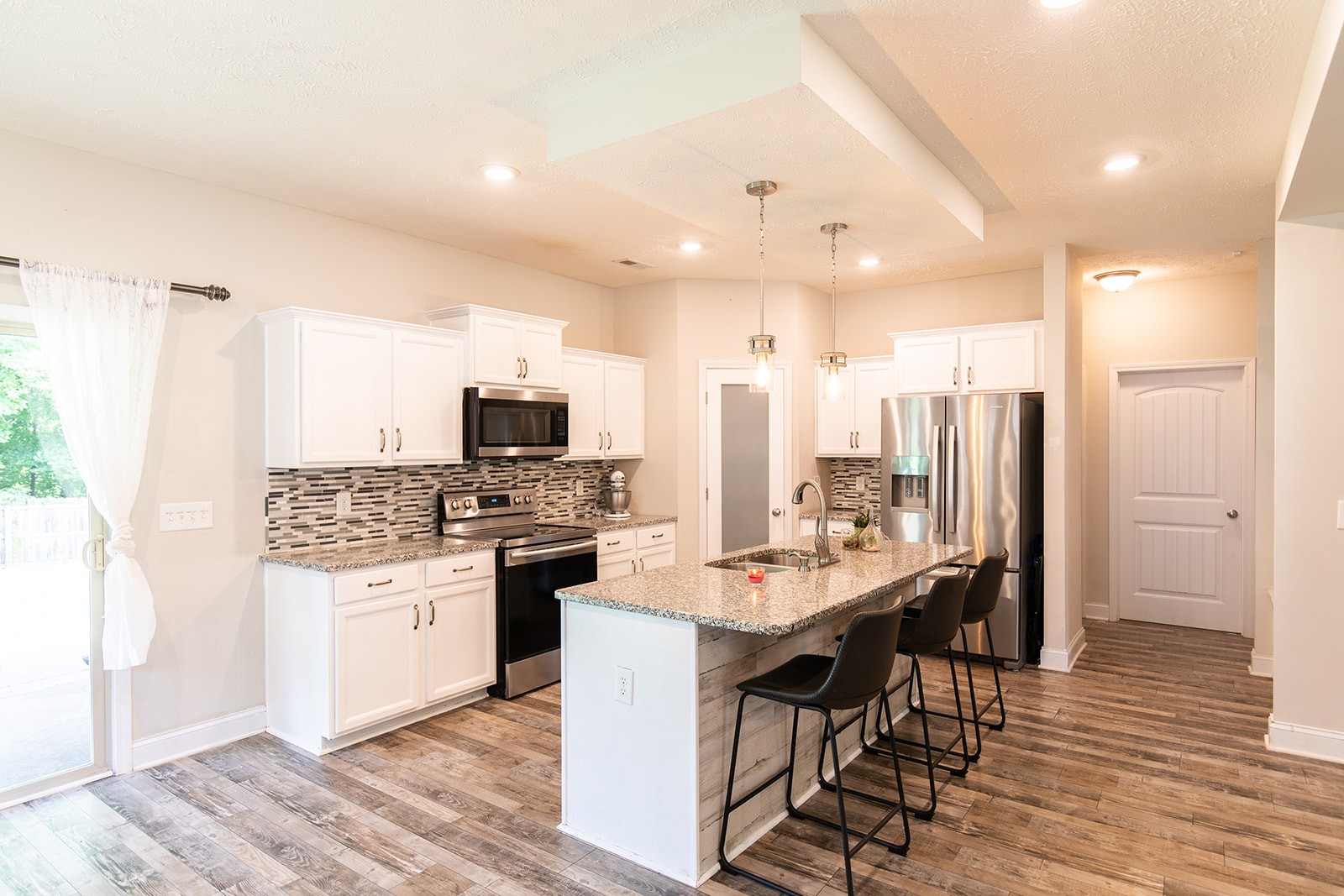 1045 Fuji Lane Clarksville, TN 37040 - Photo 6 of 24 a large kitchen with a table and chairs